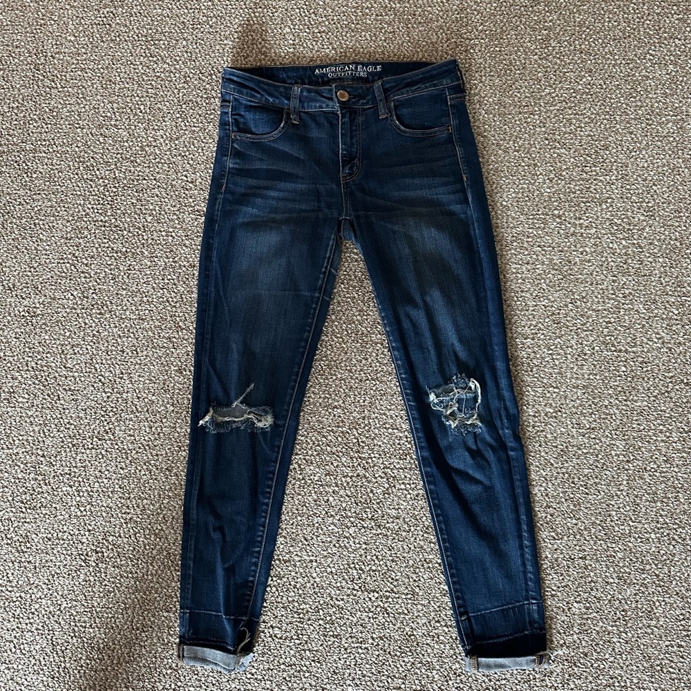 Dark blue American Eagle super stretched skinny jeans with rips